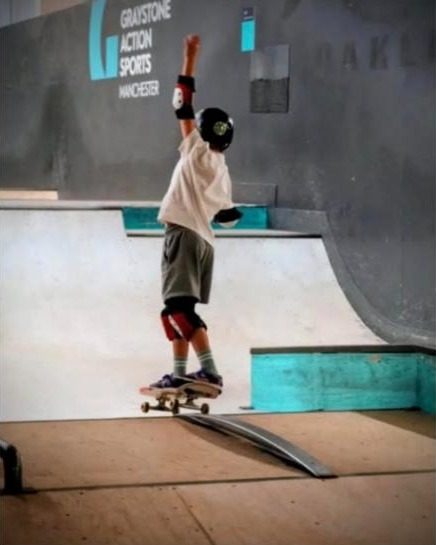 A young skater on a ramp